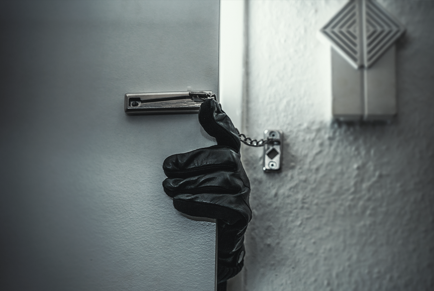hand with glove opening close door