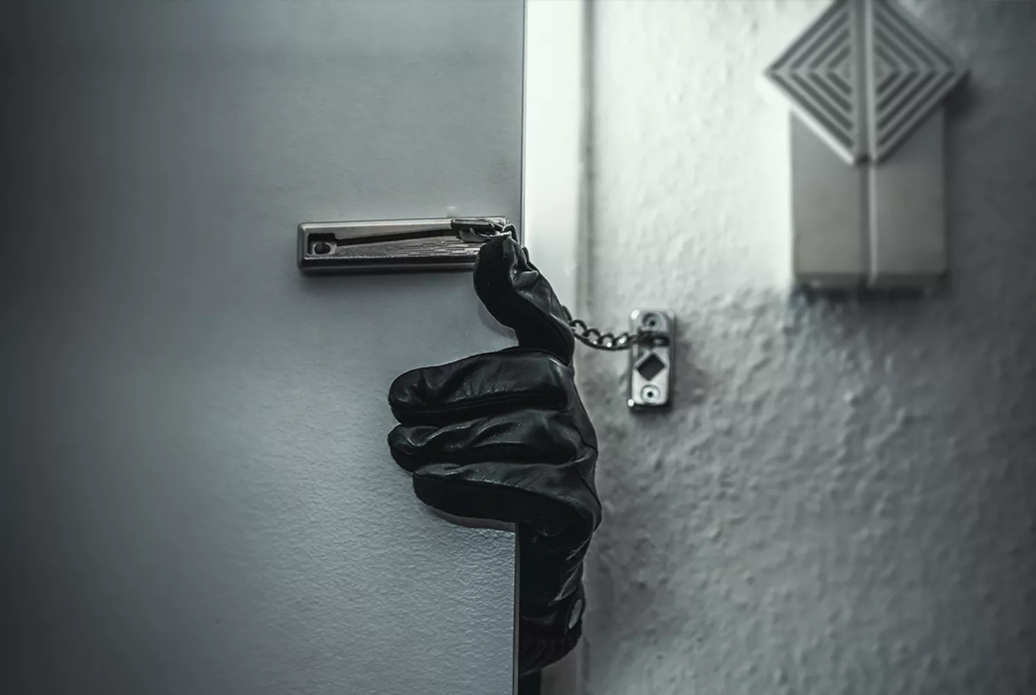 hand with glove opening close door