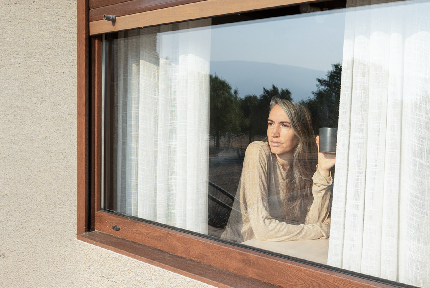 woman looking out of the window
