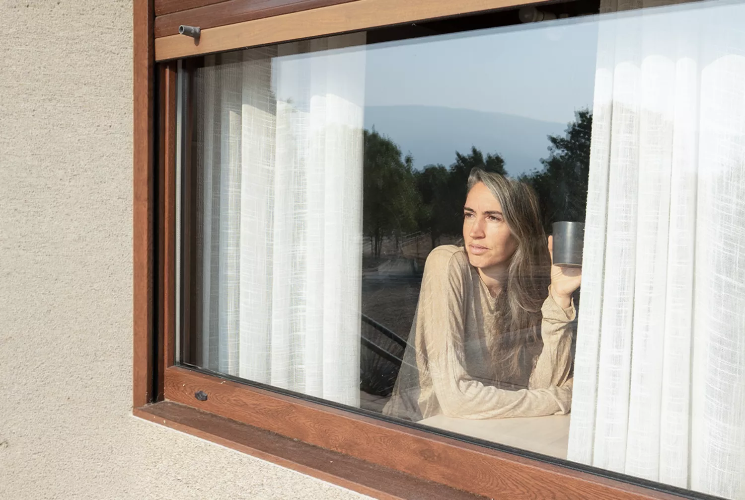 woman looking out of the window