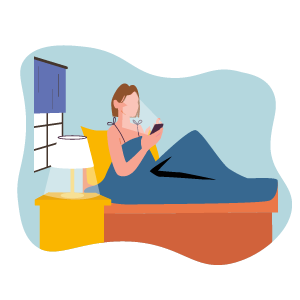 woman in her bed looking at her phone