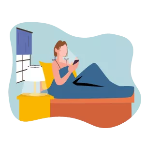 woman in her bed looking at her phone
