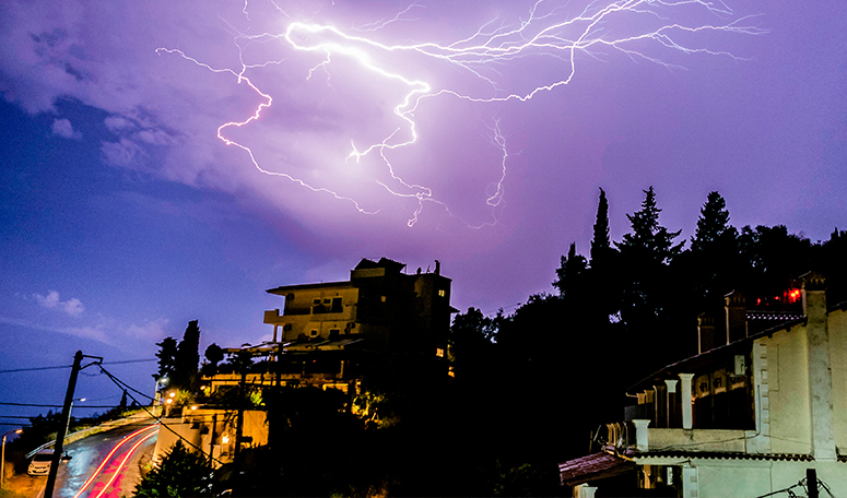 town with storm weather with lightnings
