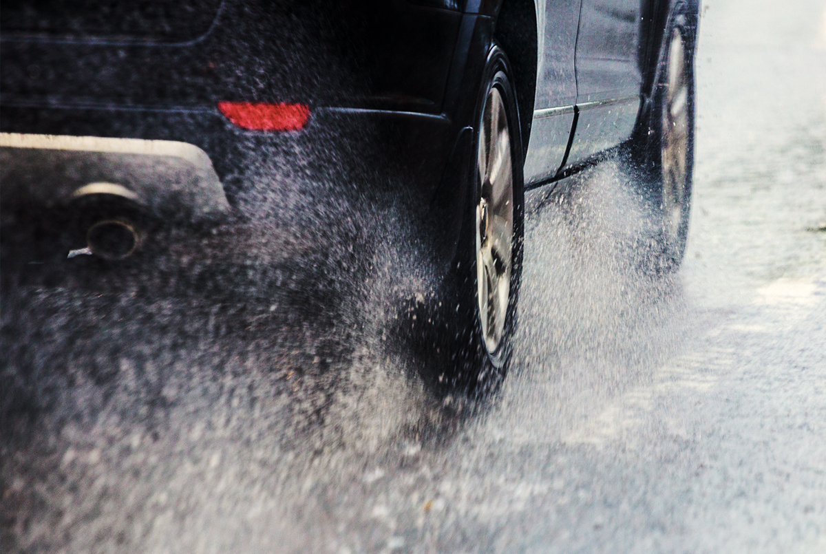 picture showing the tire of a car in a rainy day